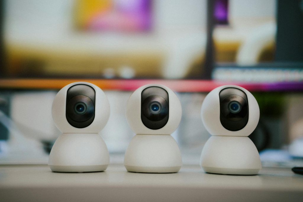 webcam security camera smart home monitoring equipment on home office table