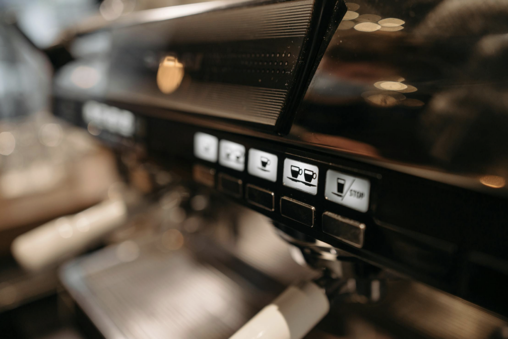 Close-up of a coffee maker's control panel with white buttons showing coffee cup icons and a STOP button on the right.

https://www.pexels.com/photo/close-up-shot-of-an-espresso-machine-6612594
