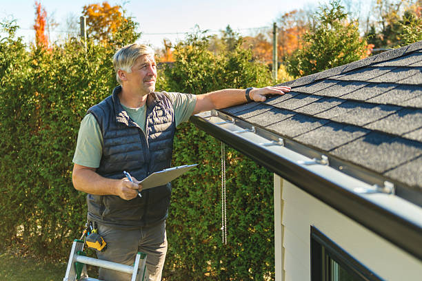 man inspecting his home
and the roof