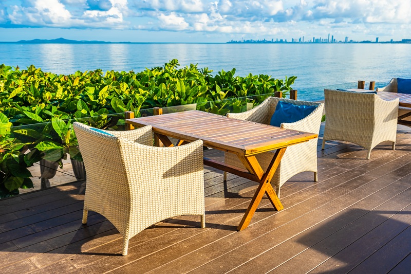 Empty table and chair for dining set nearly sea ocean beach on w