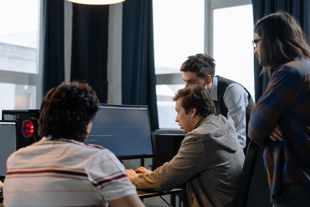 Team looking at a computer AI